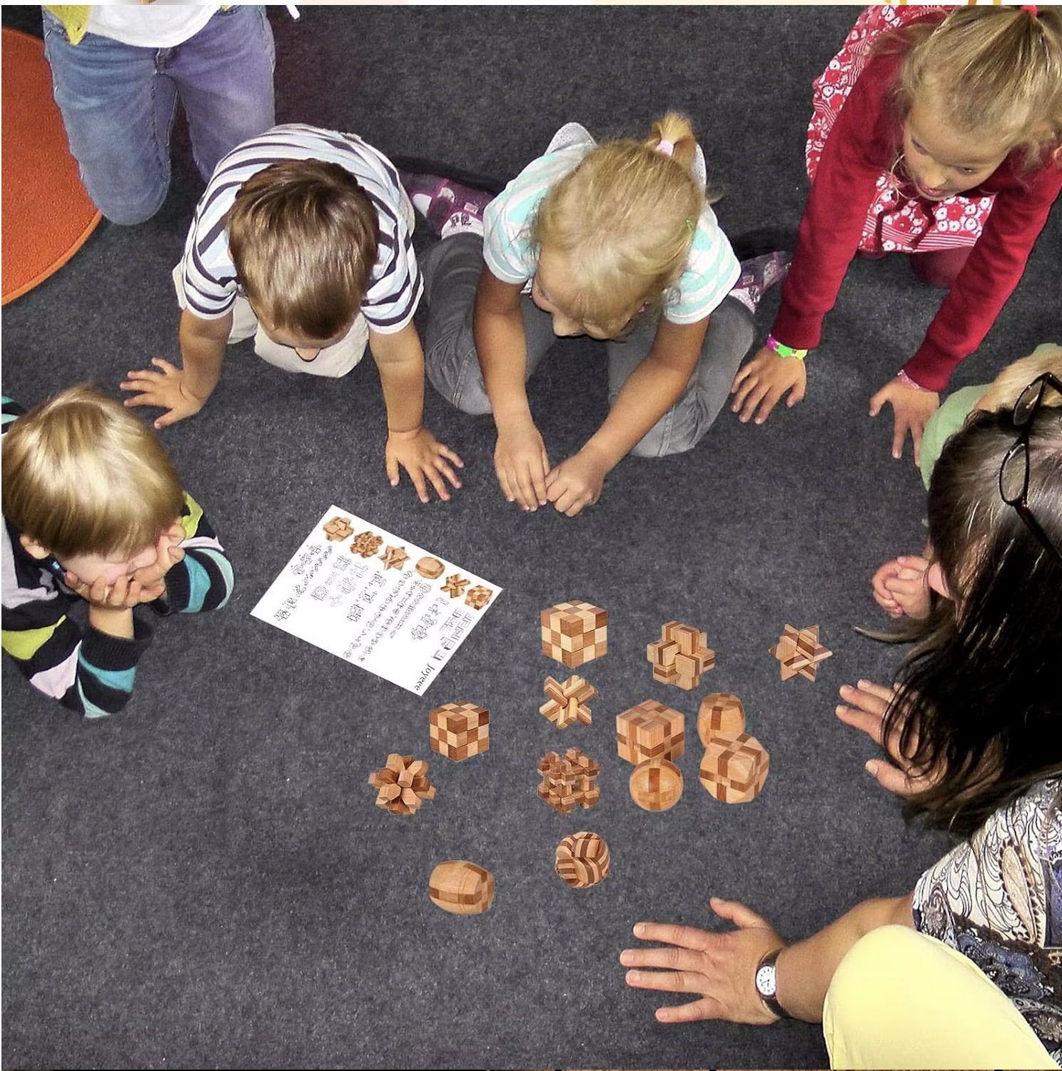 Children solving wooden logic puzzles in a group